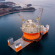 Illustration for article titled Here's The Largest Oil Rig Ever On Top Of The Largest Transport Ship